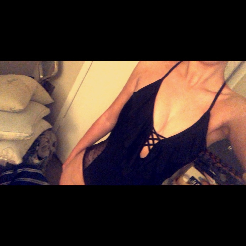 Black one-piece with a V-neck line & mesh sides